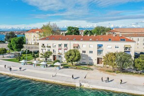 Stroll along the waterfront promenade, taking in the views of the sea from a variety of buildings with traditional and modern architectural styles.