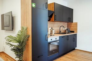 Condo superior, 2 quartos | Cozinha privada | Geladeira, fogão, cooktop, lava-louças