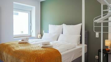 Condo superior, 2 quartos | Roupas de cama premium, edredons de pluma, cortinas blackout