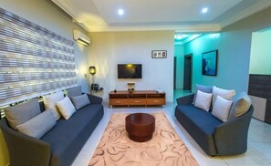 Economy Apartment, Balcony, City View | Living area | TV - Haute ApartHotel (Lagos)
