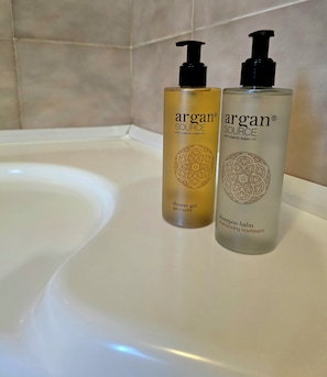 Separate bathtub and shower, hair dryer, towels, soap