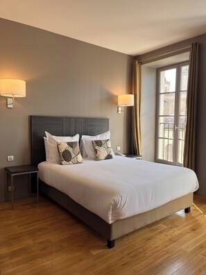 Superior Double Room, City View | 1 bedroom, blackout drapes, soundproofing, iron/ironing board