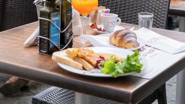 An outdoor dining table with food, drinks, and condiments. - La Boutique by Rjgal  (Florence)