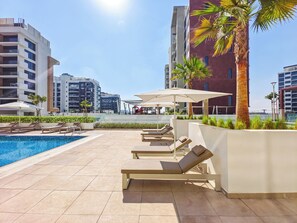 Outdoor pool - Relaxing Studio Retreat in Vibrant Meydan City, (Dubai)