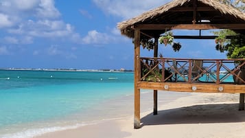 On the beach, sun-loungers, beach towels
