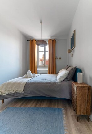 1 bedroom, desk, iron/ironing board, travel crib