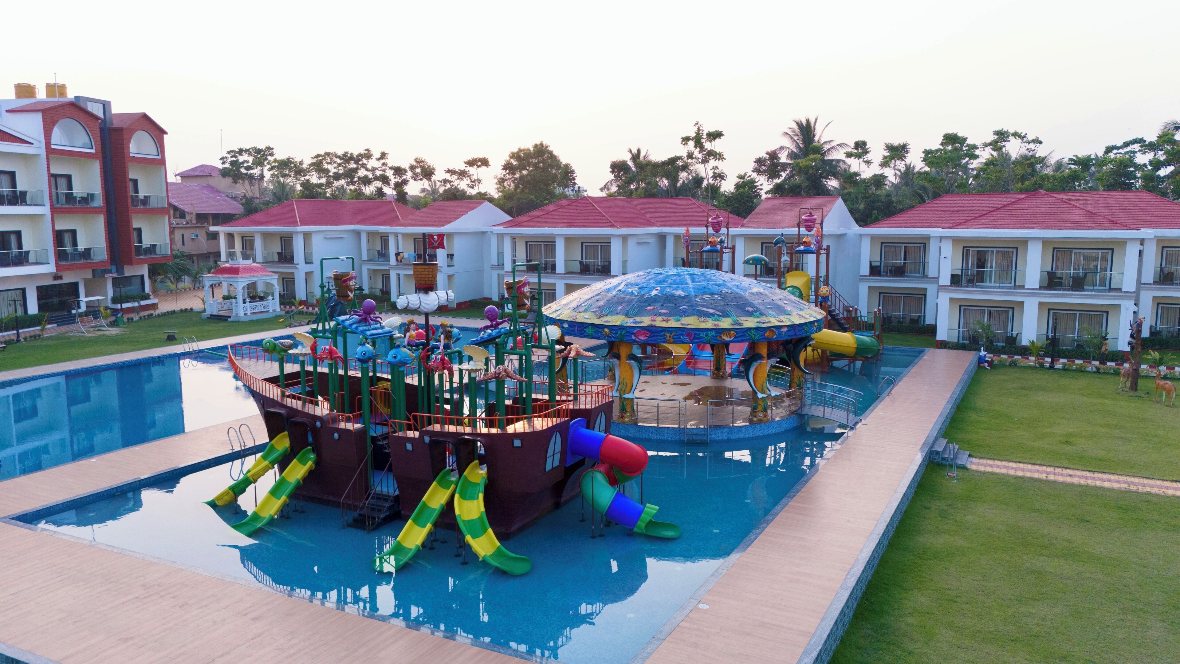A water park with slides and a large pool.