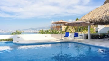 Outdoor pool, pool umbrellas, pool loungers