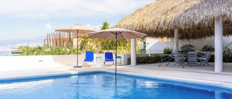 Outdoor pool, pool umbrellas, sun loungers