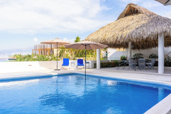 Outdoor pool, pool umbrellas, pool loungers