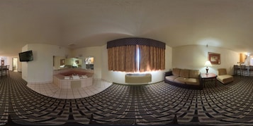 套房, 1 张特大床, 无烟房, 按摩浴缸 | 办公桌、笔记本电脑工作区、免费折叠床/加床、床单