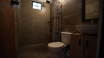 Shower, towels, soap, toilet paper