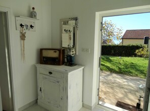 A bathroom with a vintage radio, a mirror, and a decorative item on a dresser. - Spacious Novi Vinodolski Apartments With Terrace and Shared Pool (Novi Vinodolski)