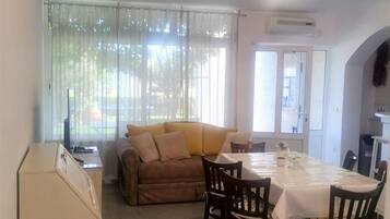 Apartment (Two Bedroom Apartment with Terrace) | Living room | 32-inch flat-screen TV with cable channels