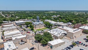 Aerial view - All Remodeled 5 STAR. Steps to square! 3 Bedroom 2 Bath Front Half of cottage. (Granbury)