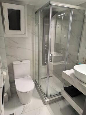 Shower, free toiletries, hair dryer, slippers