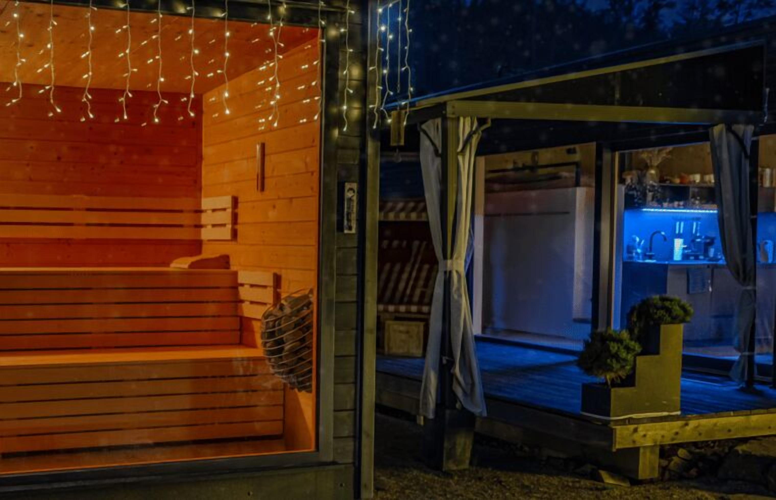 A cozy wooden cabin with a warm interior and a bar area visible through a glass door.