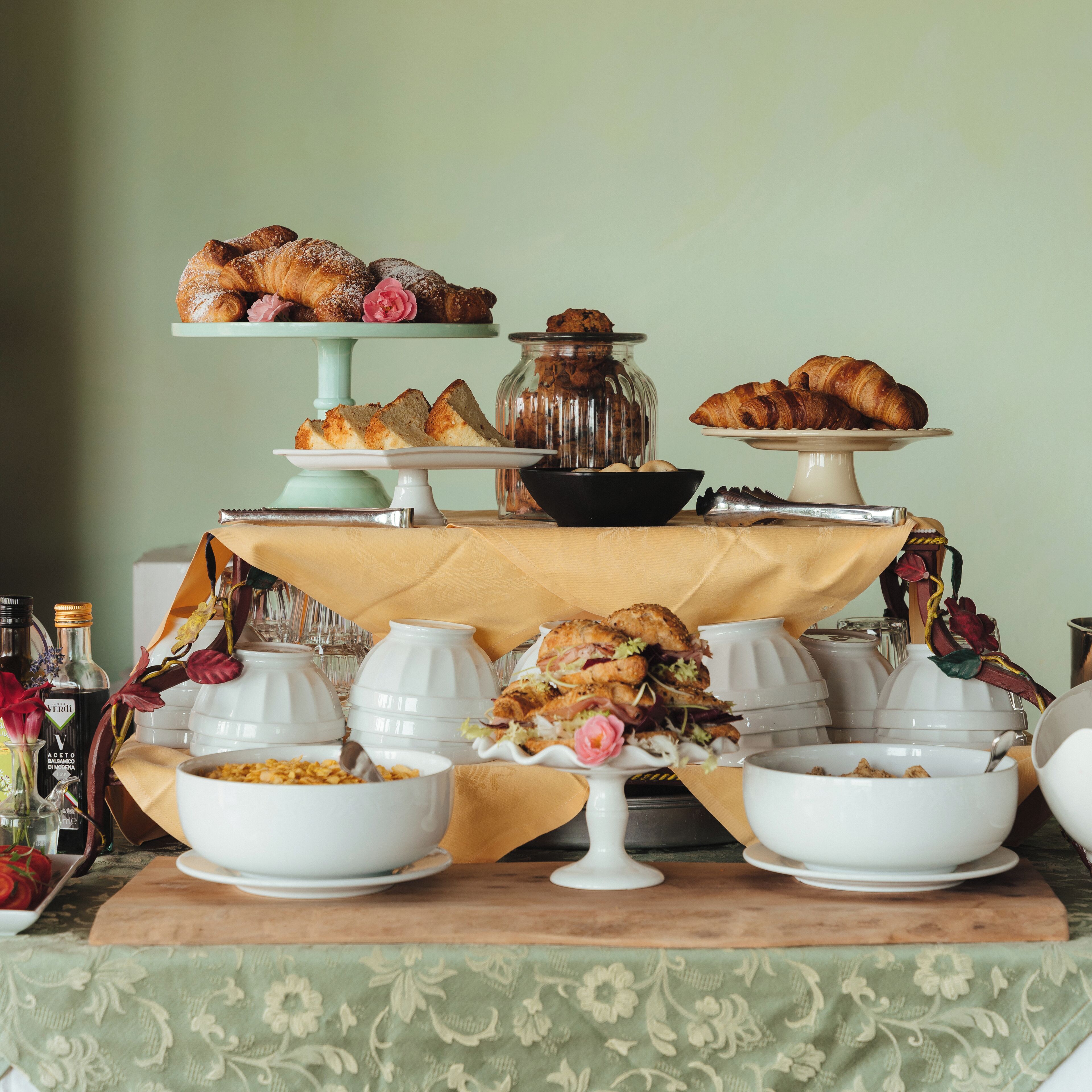 A buffet table with various food items and serving dishes.