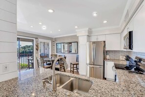 Fridge, microwave, stovetop, dishwasher - Admiral's Row 109 | Oceanfront Living | Pool, Pickleball & Pro Tennis (Hilton Head Island)