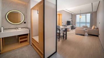 Deluxe Suite, 1 King Bed, Sea View | Bathroom | Free toiletries, hair dryer, bathrobes, slippers