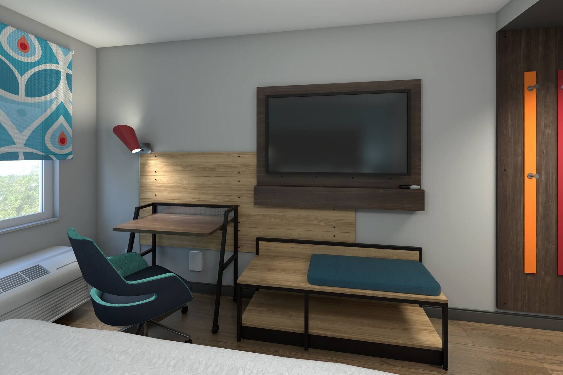 A modern hotel room with a bed, a desk, a chair, a TV mounted on the wall, and a window with curtains.