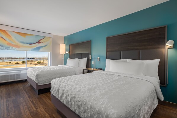 Habitación, 2 camas Queen size | Cortinas blackout, wifi gratis y ropa de cama 