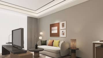 Deluxe suite, 1 kingsize bed | Woonruimte | Een lcd-televisie