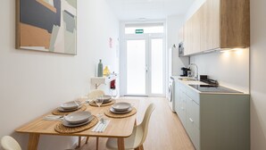 A modern kitchen with a dining area.