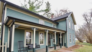 A two-story house with a porch, a front door, and a mailbox. - Charming 4 Bed, 2.5 Bath home minutes from Madison perfect for any occasion. (McFarland)