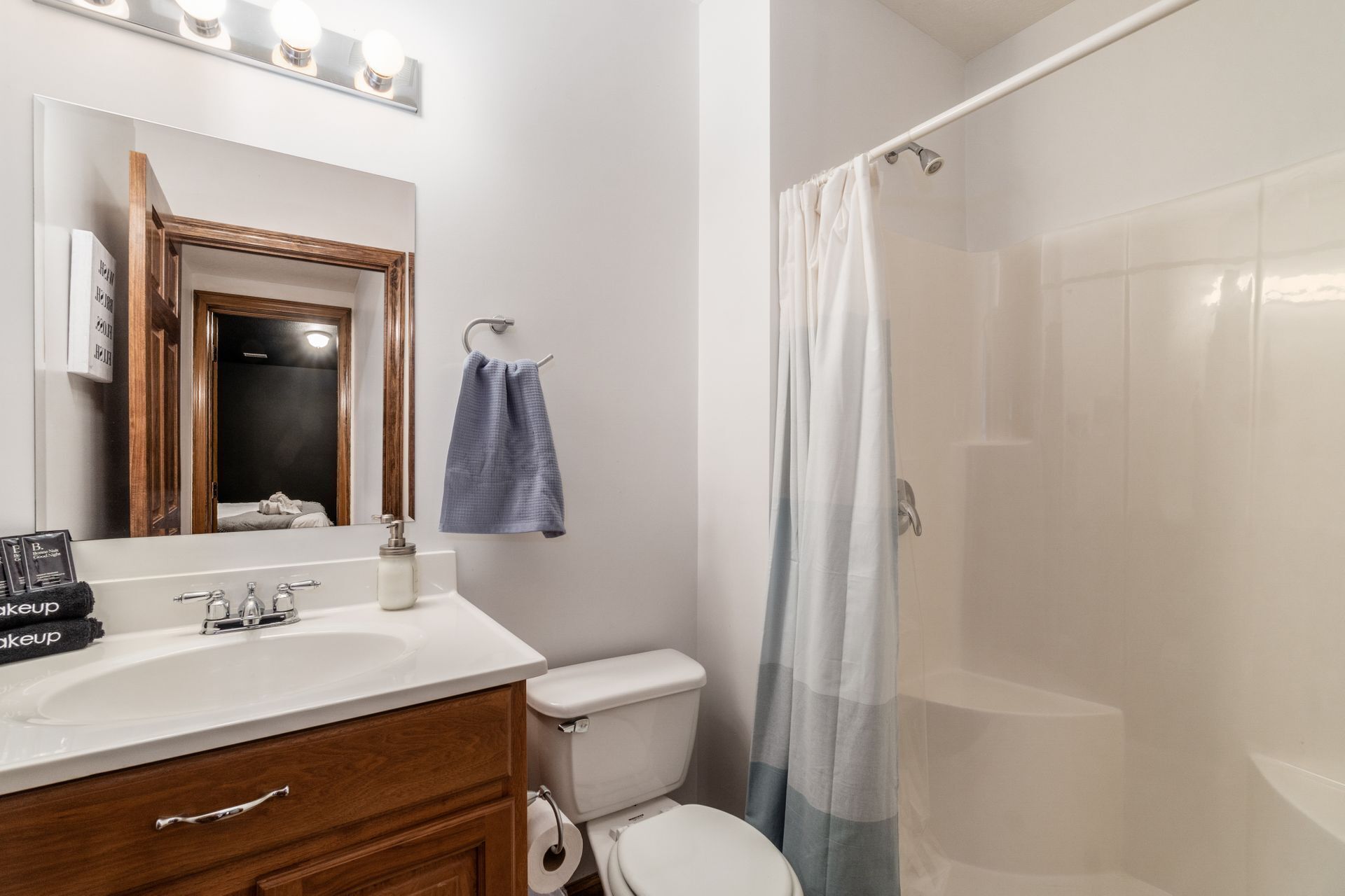 Cozy bathroom with rustic touches, a walk-in shower, and plenty of space.