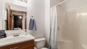 Cozy bathroom with rustic touches, a walk-in shower, and plenty of space.