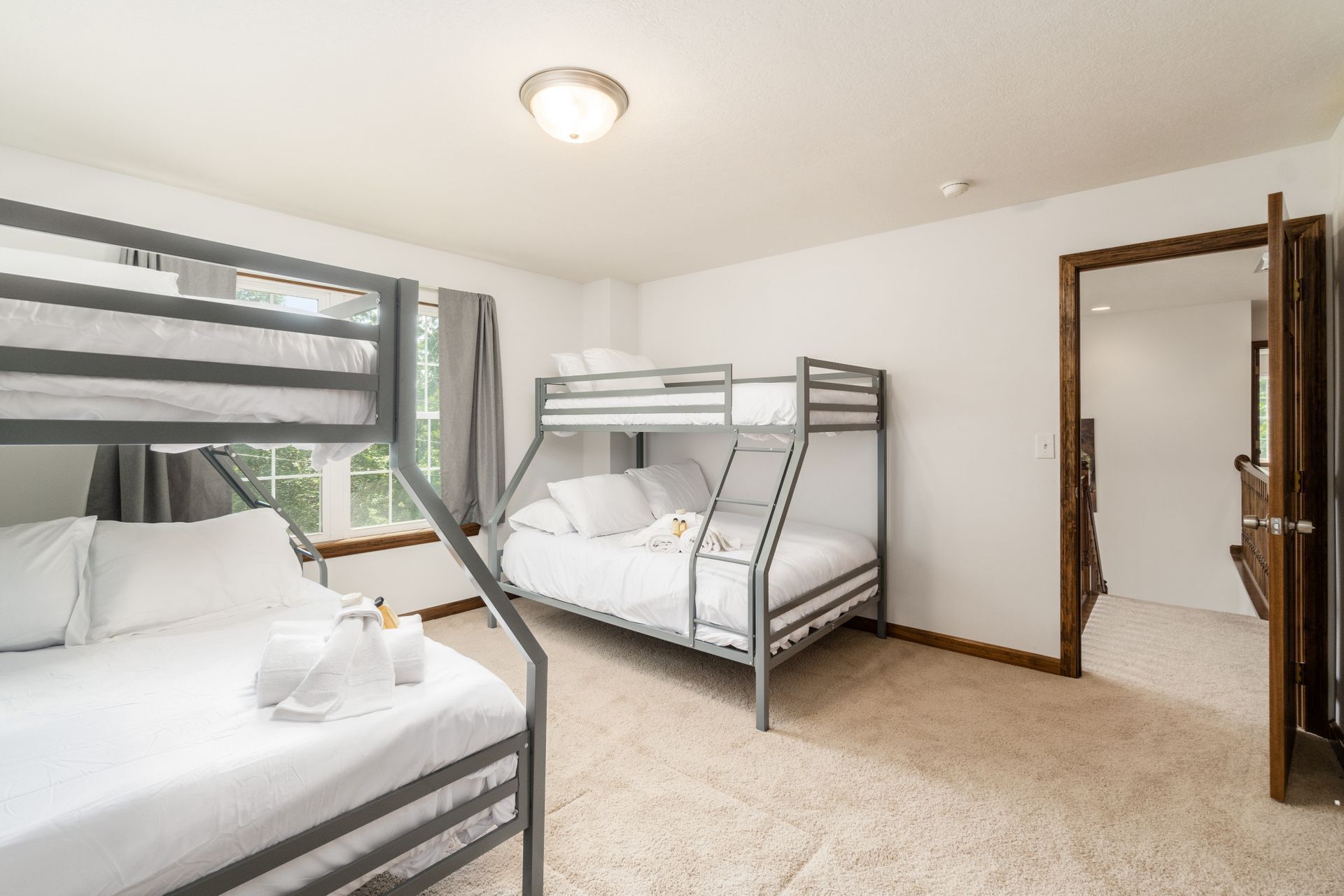 Charming third bedroom with bunk beds, ideal for kids or extra guests.
