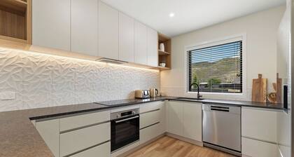 Warm and stylish new home close to river, lake, restaurants and golf course.