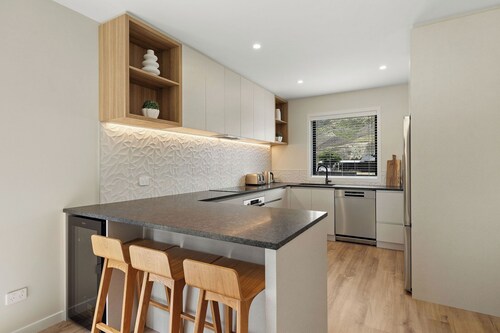 Warm and stylish new home close to river, lake, restaurants and golf course.