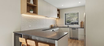 Warm and stylish new home close to river, lake, restaurants and golf course.