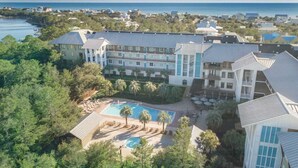 A resort with a pool, multiple buildings, and a view of the ocean. - Hello 30a! by Avantstay Private Beach Access + Shared Pool (Santa Rosa Beach)