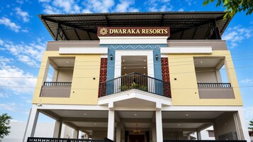 A multi-story building with a sign reading 'DWARAKA RESORTS'.