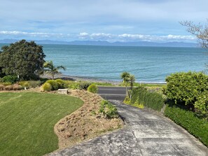 Property grounds - Charming Waharau seaside holiday house close to regional park. (Whakatiwai)