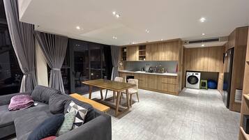 Deluxe Duplex, Balcony, City View | Living area | Flat-screen TV