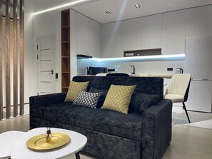 Family Studio Suite, Balcony, City View | Living area | 43-inch flat-screen TV with digital channels, TV - Akay city Golden studio (Tashkent)