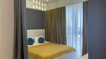 Family Studio Suite, Balcony, City View | Blackout drapes, soundproofing, iron/ironing board, free WiFi
