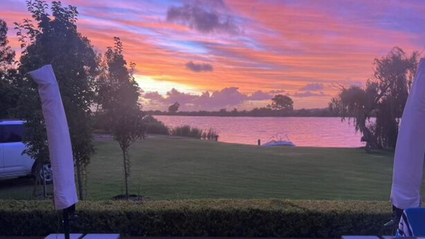 A deck with a view of a lake at sunset. - On The Bend- Absolute Waterfront Retreat (Tailem Bend)
