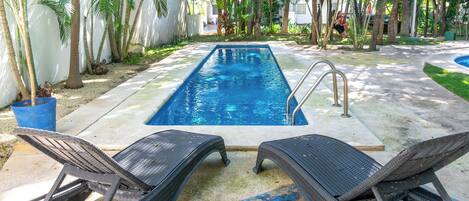 Outdoor pool, open 7:00 AM to 10:00 PM, pool umbrellas, sun loungers