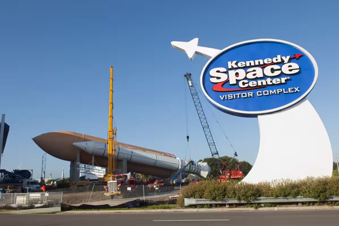 The Kennedy Space Center Visitor Complex with a large rocket on display.