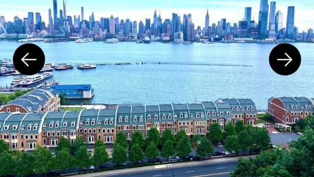 A waterfront hotel with a row of buildings, a marina, and a city skyline in the background. - Cozy Apt With King Size Bed- Only 5 Miles to NYC (North Bergen)