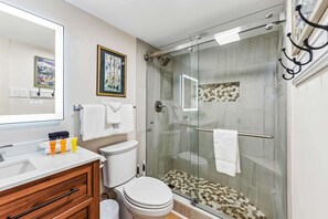 Shower, hair dryer, towels, shampoo