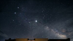 A modern building with a starry night sky. - Sacred Sands - Lobo Luna (Joshua Tree)