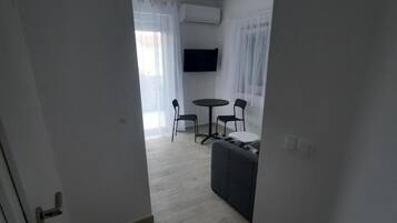 32-inch flat-screen TV with satellite channels