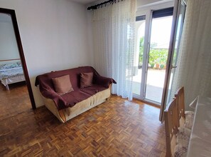 Apartment (One Bedroom Apartment with Terrace) | Living room | 31-inch flat-screen TV with cable channels