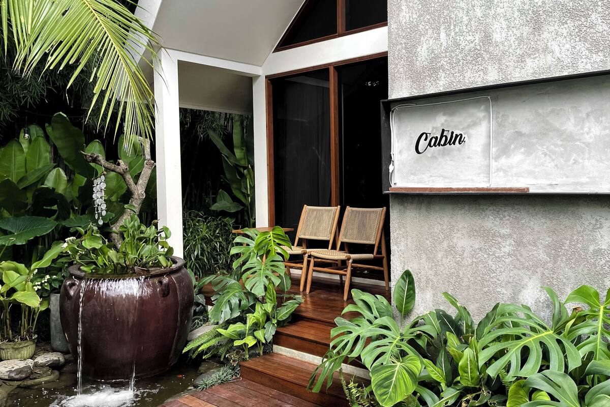 A modern building with a sign reading "Cabin".